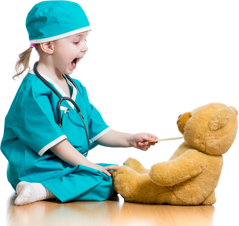 Cute girl pretending to be a doctor with her teddy as the patient